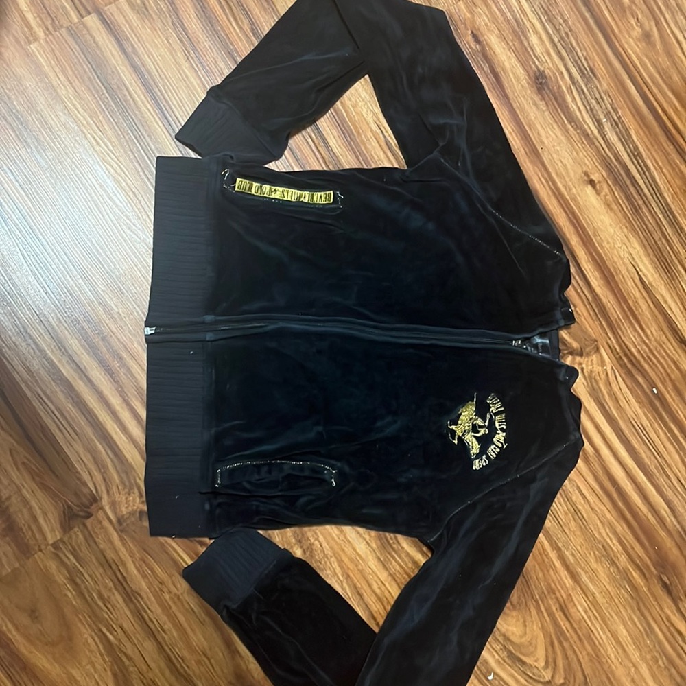 This is a black polo sweater